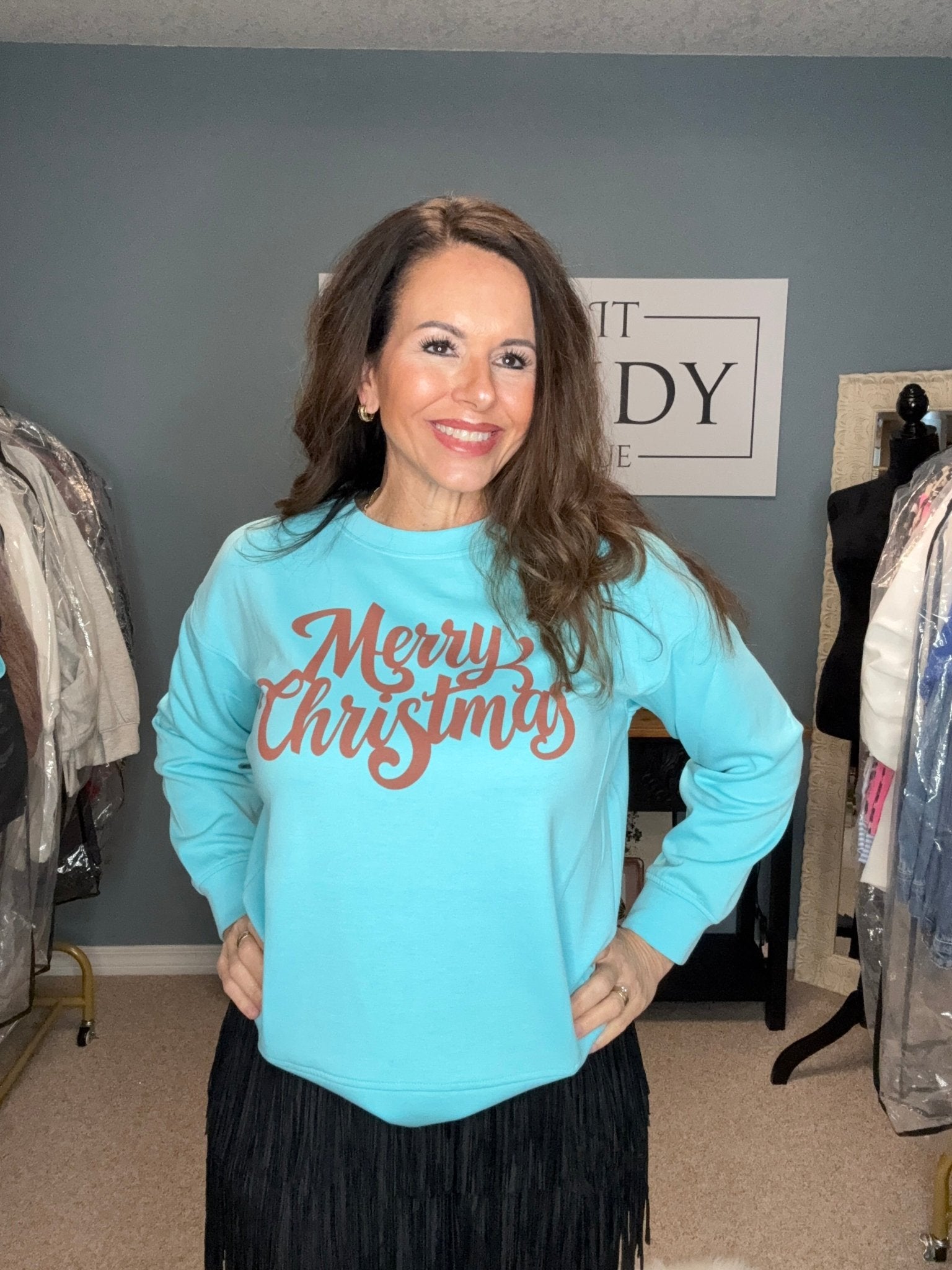 Smiling woman in Zenana Merry Christmas sweatshirt. Tiffany Blue Holiday Fashion. Main Street Collective