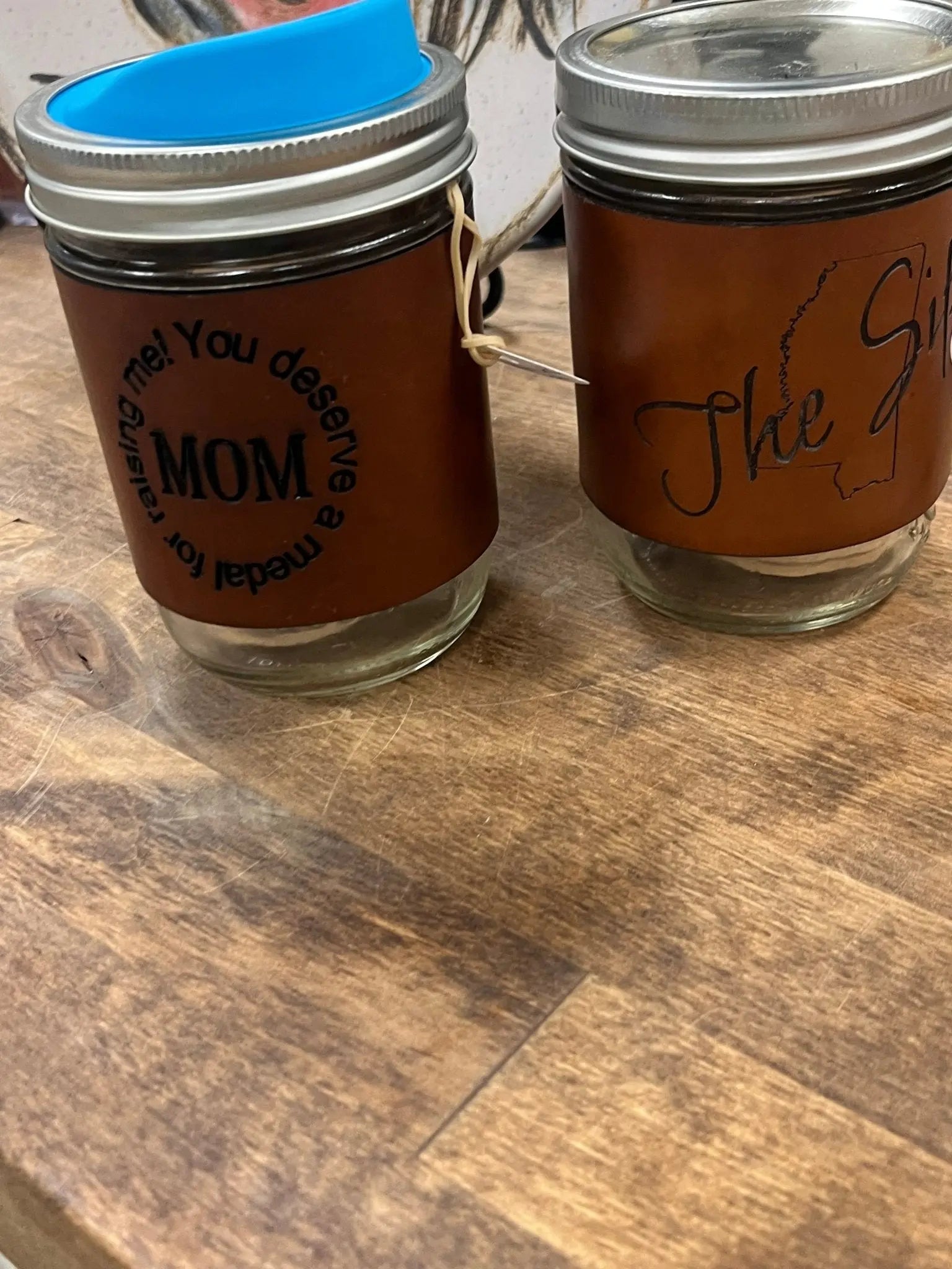 Custom Leather Wrapped Mason Jar Mugs: Engraved "Mom" and "The SIL" on Wood. Rustic Coffee Cups, Personalized Gift.