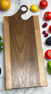 Mississippi handmade gift – vertical photo of walnut and maple charcuterie board by Faithful Woodworks, showcasing natural wood tones and handcrafted detail.