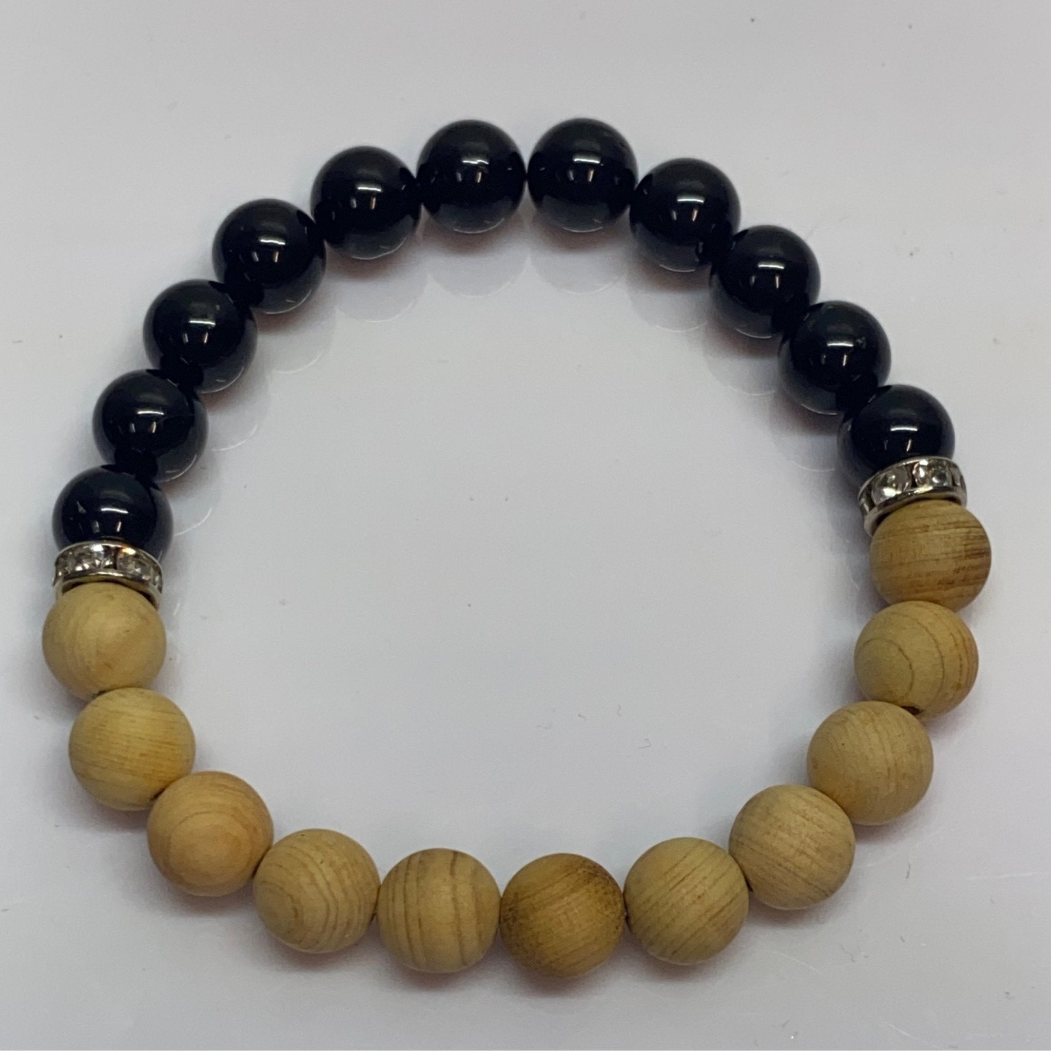 Handmade bracelet with 8mm Shungite stones and Palo Santo wood beads from Hands of Earth Energy