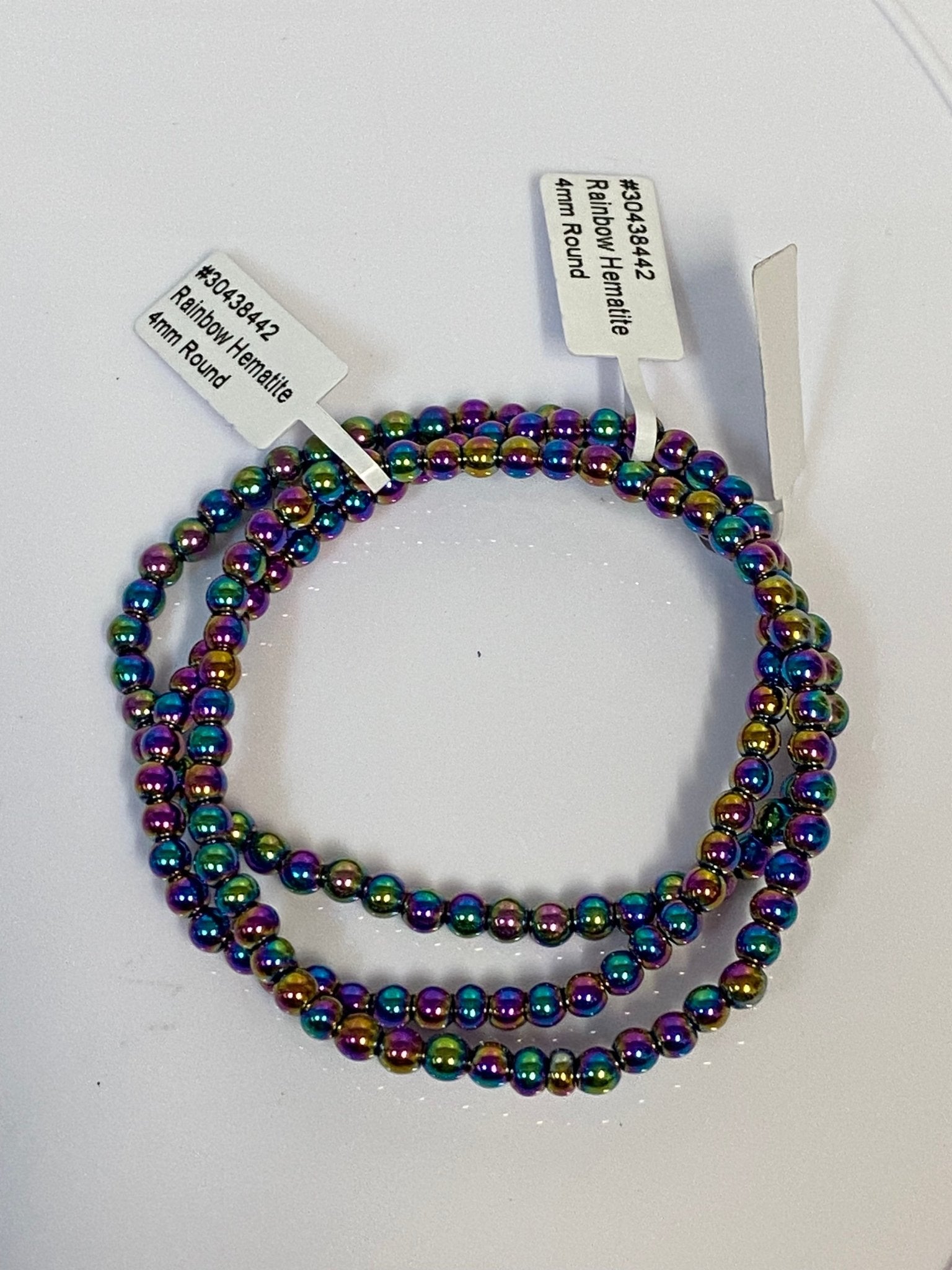 Handmade Rainbow Hematite bracelet with 4mm iridescent gemstone beads from Hands of Earth Energy