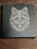 Rustic wildlife coaster – detailed engraving of wolf face on slate coaster by Faithful Woodworks.