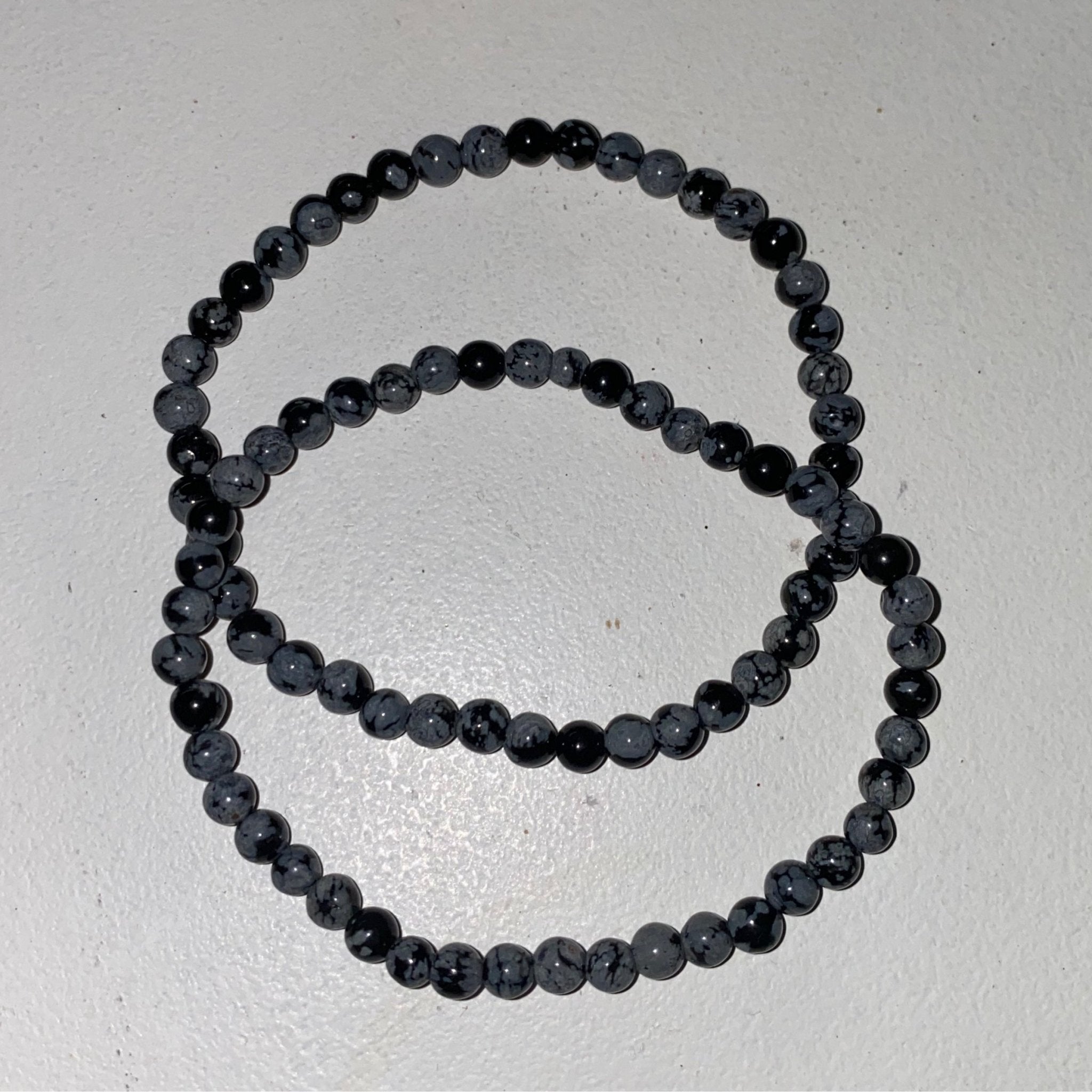 Handmade Snowflake Obsidian bracelet with 4mm natural black and white gemstone beads from Hands of Earth Energy
