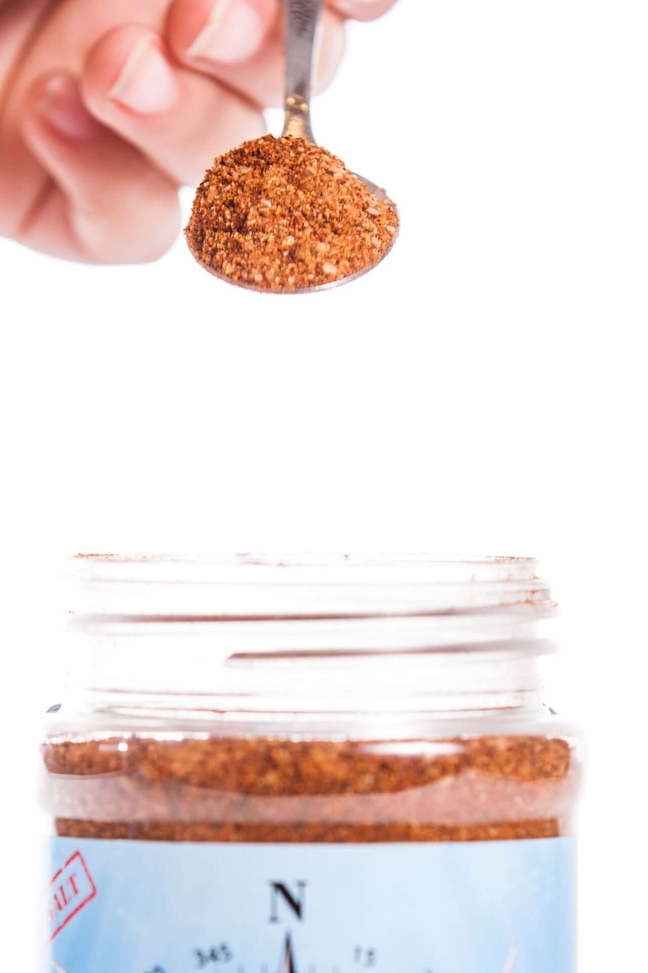 Spoonful of Smoky Sweet BBQ rub showing texture and spice blend