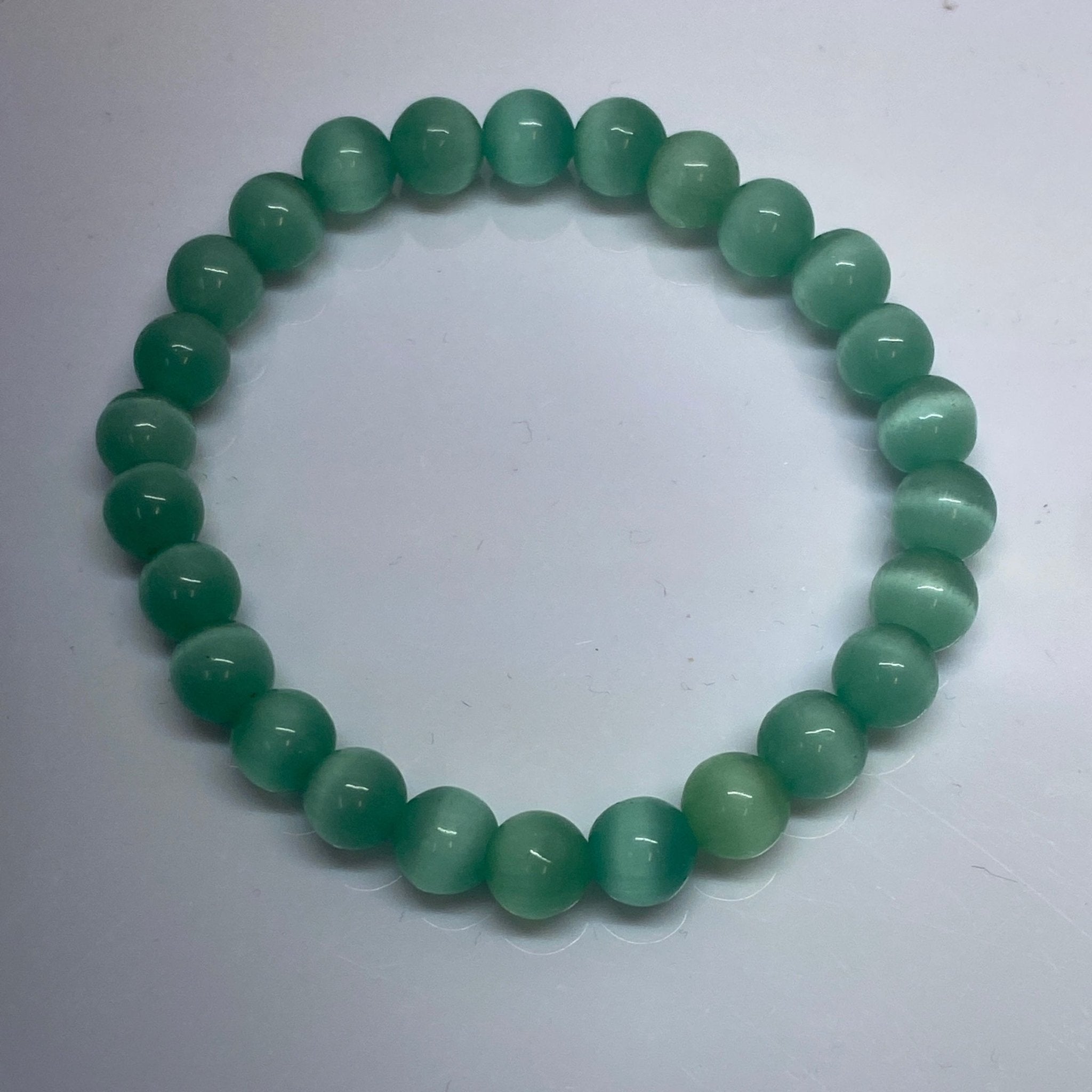 Handmade Teal Cat Eye bracelet with 8mm vibrant glass beads from Hands of Earth Energy