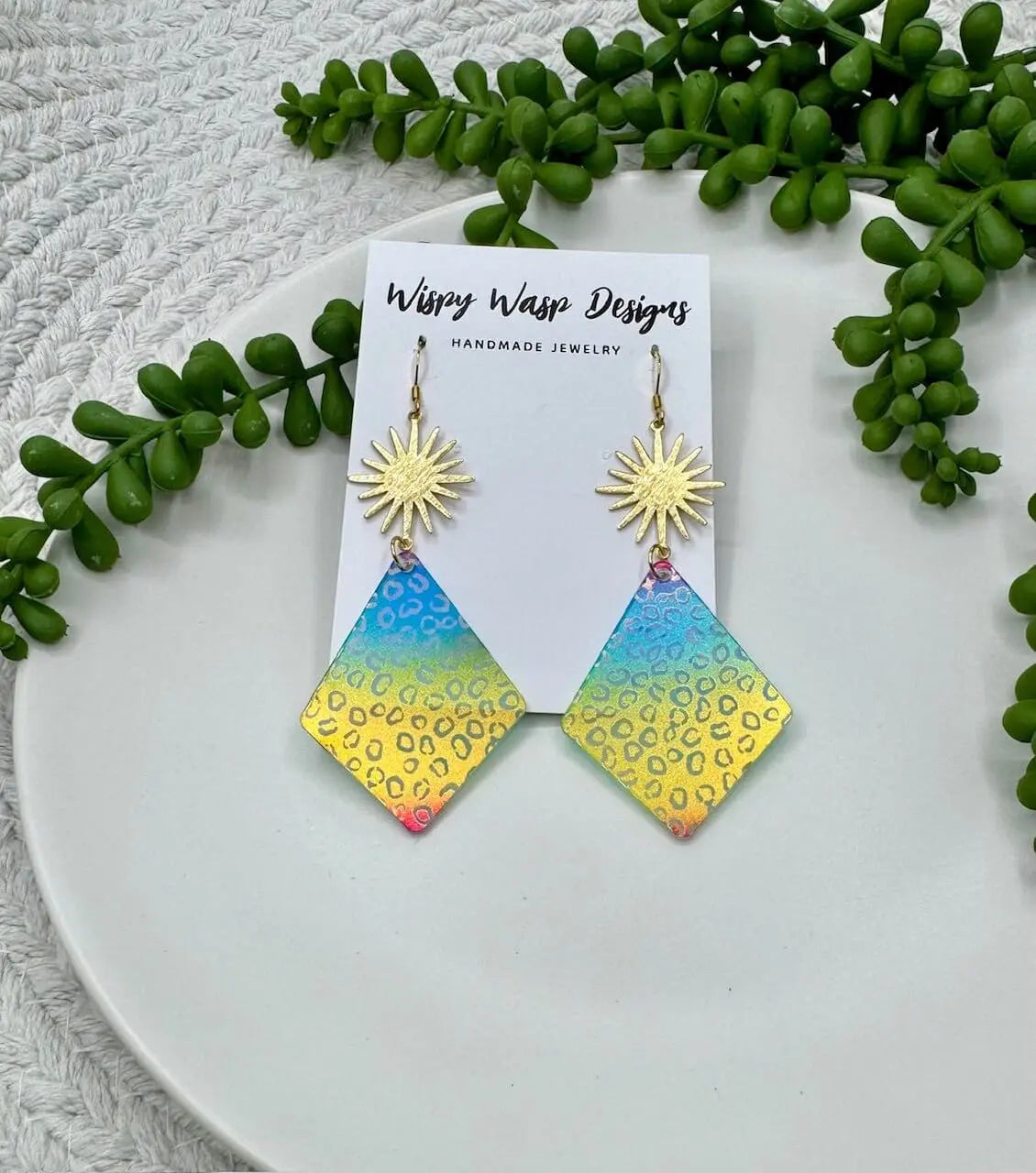 Wispy Wasp Rainbow Leopard Earrings: Handmade sunburst earrings with vibrant acrylic. Mississippi handmade jewelry.