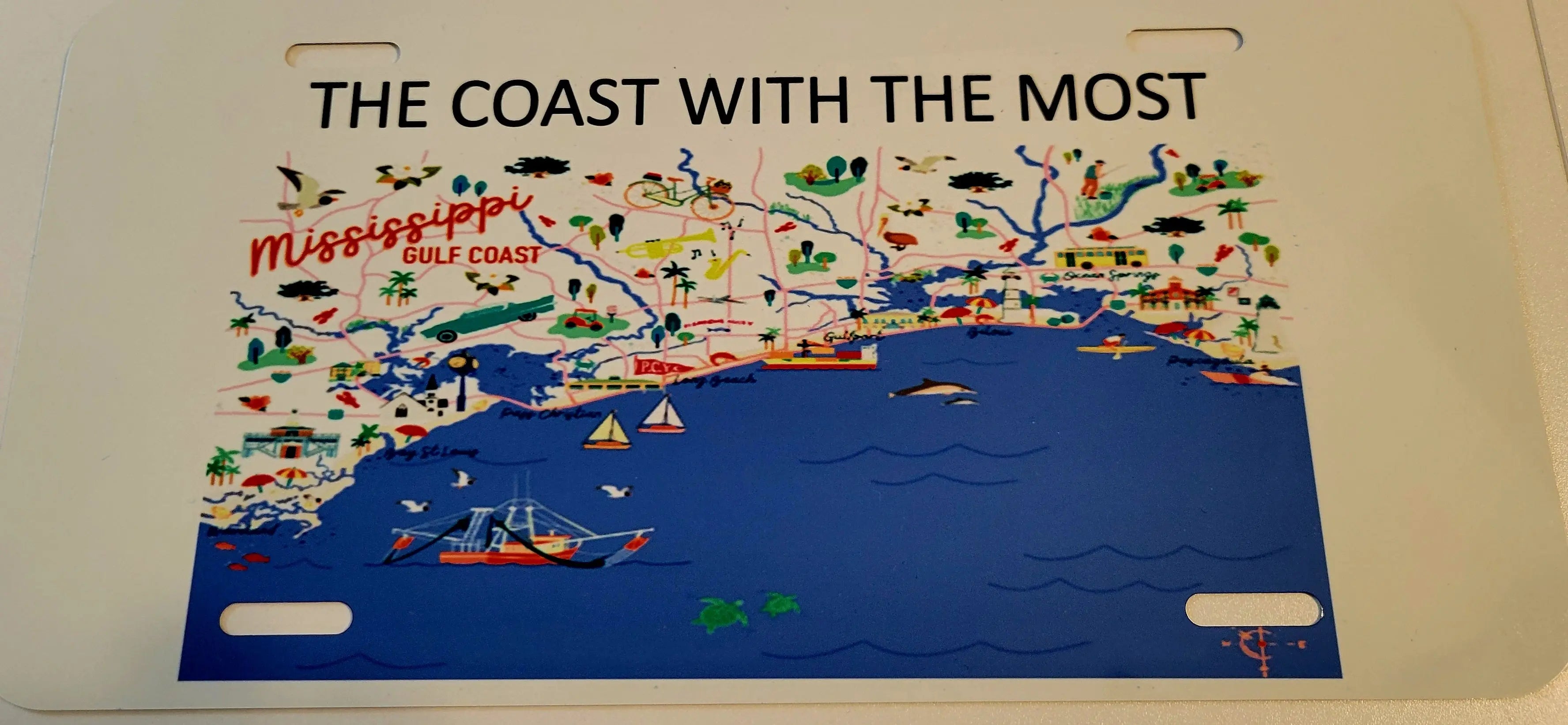 Mississippi Coast license plate: An illustrated map of the Gulf Coast with icons and coastal towns.