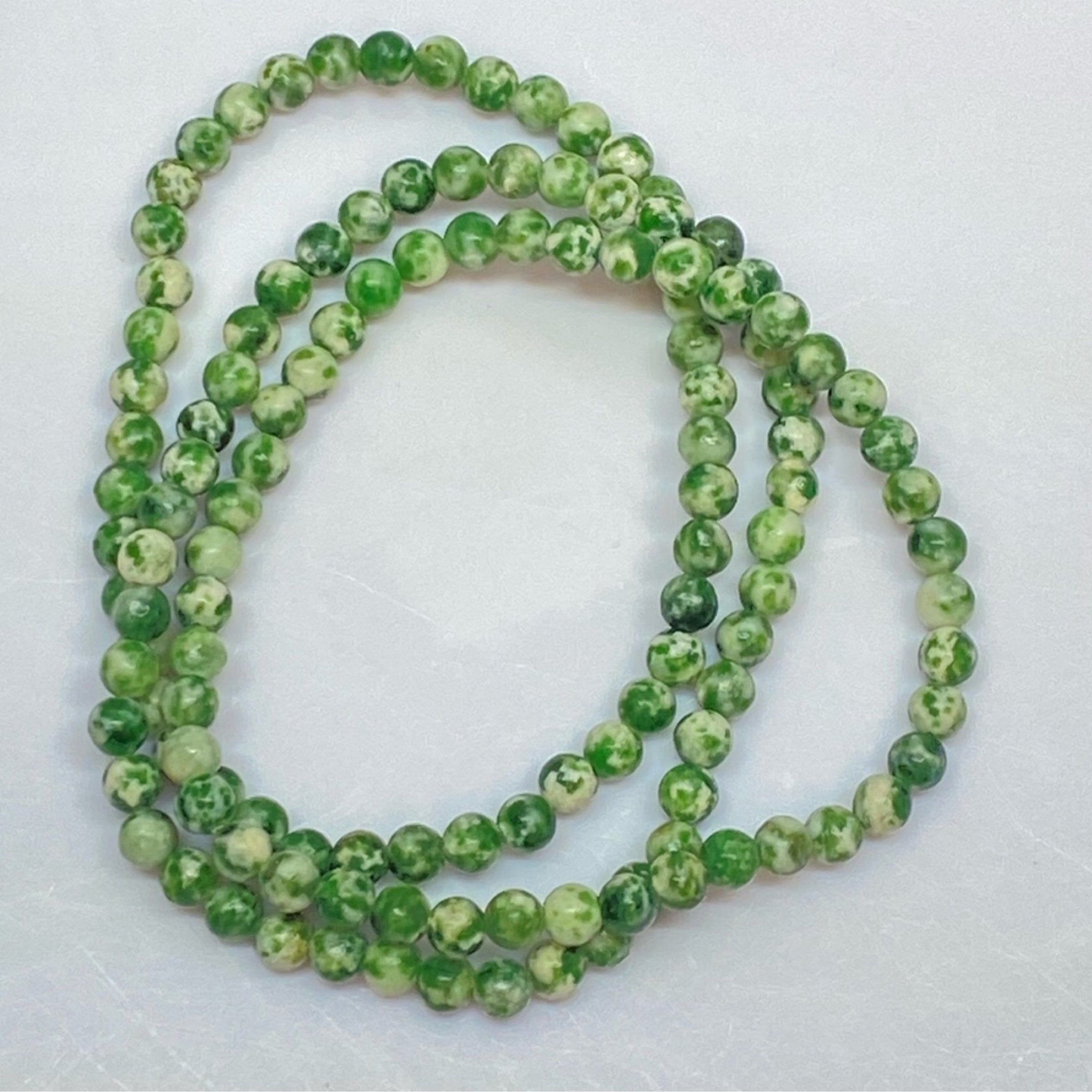 Handmade Tree Moss Agate bracelet with 4mm green and white natural gemstone beads from Hands of Earth Energy
