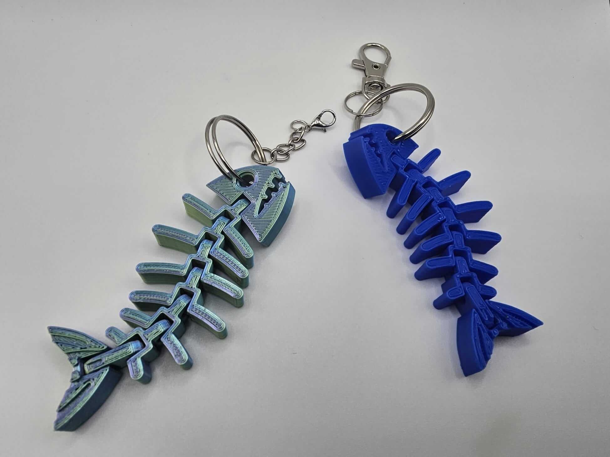 3D Printed Fishbone Keychains: Iridescent & Blue. Flexible, Articulated Gifts Handmade in Mississippi by The Tween Space.