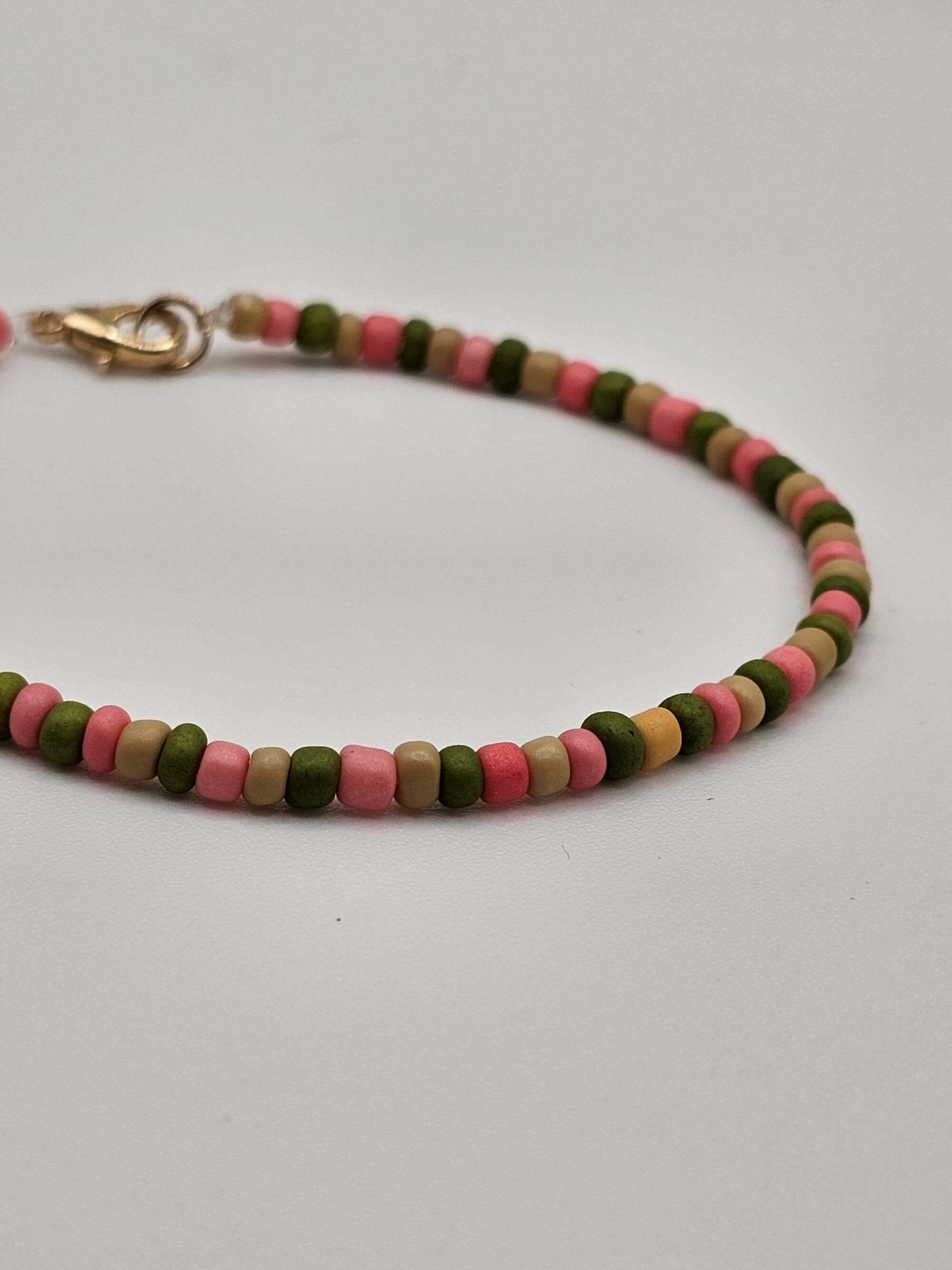 Pink & Green Tiny Bead Bracelet by The Tween Space styled with stacked bracelets – Mississippi handmade gifts