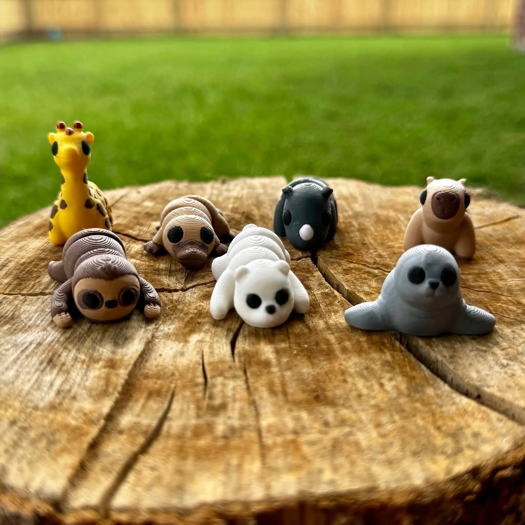 3D printed fidget zoo animals: sloth, capybara, giraffe, platypus, rhino, seal, and polar bear by Main Street Collective.