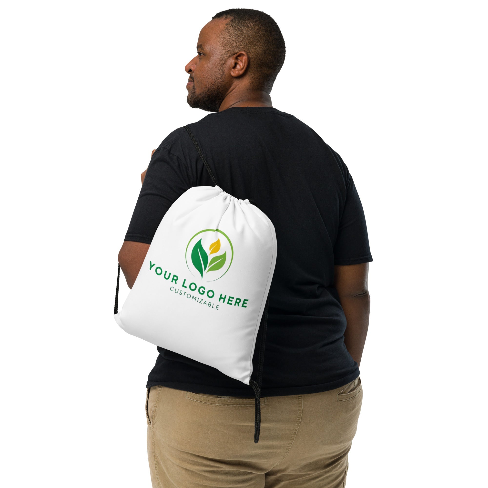 Custom drawstring bag mockup with logo, man wearing personalized promotional backpack. Customizable design.