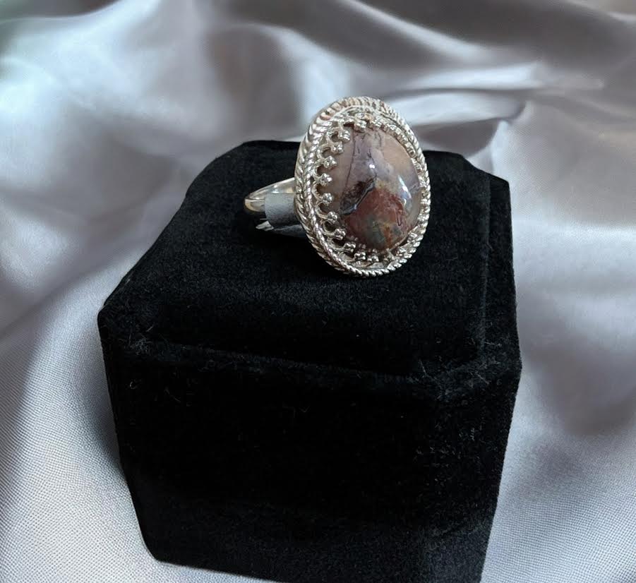 Handmade Butterfly Jasper Ring, Sterling Silver, Size 9. Oval gemstone ring on display, close up view. Artisan jewelry. 