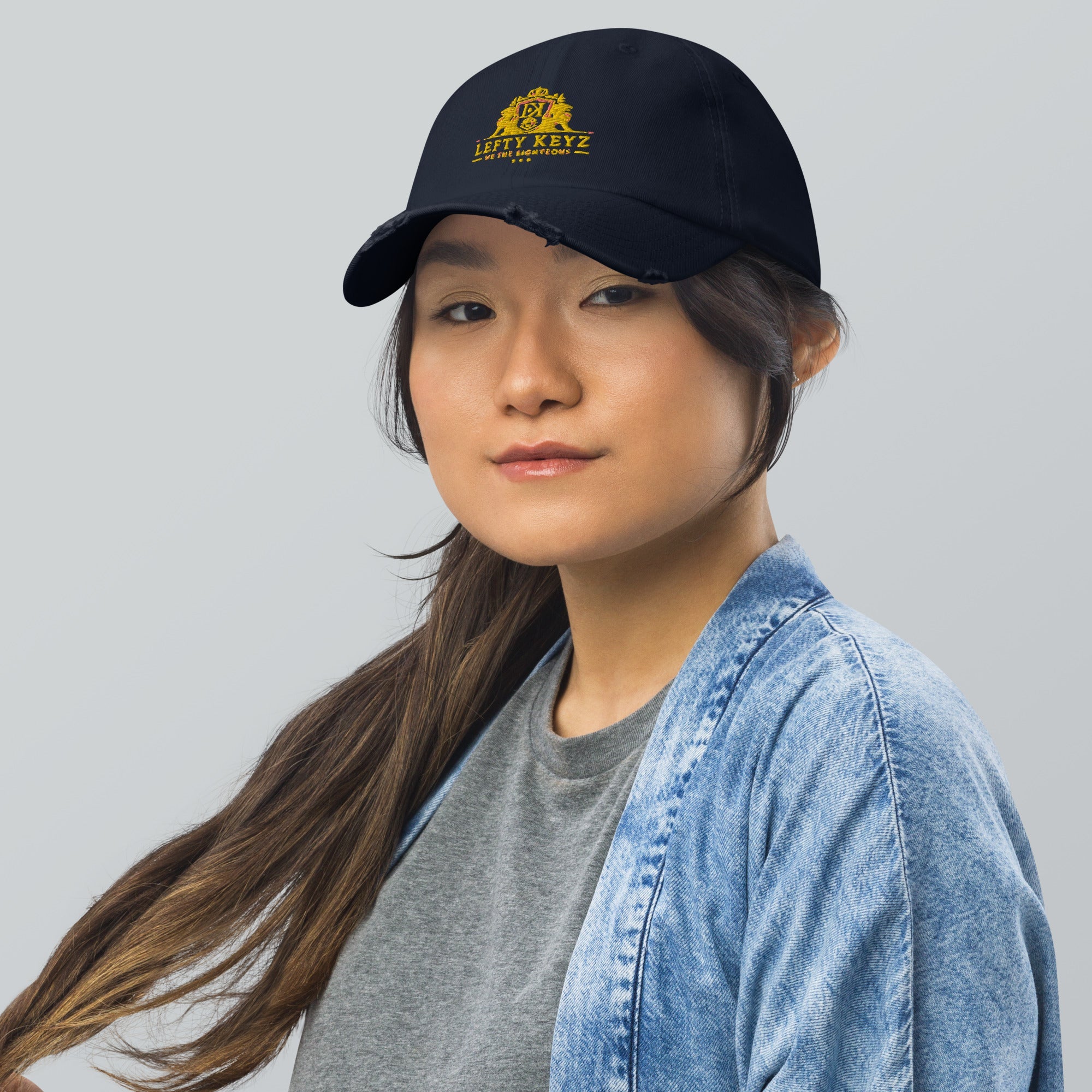 Woman Wearing Lefty Keyz Distressed Dad Hat | Main Street Collective Navy Cap