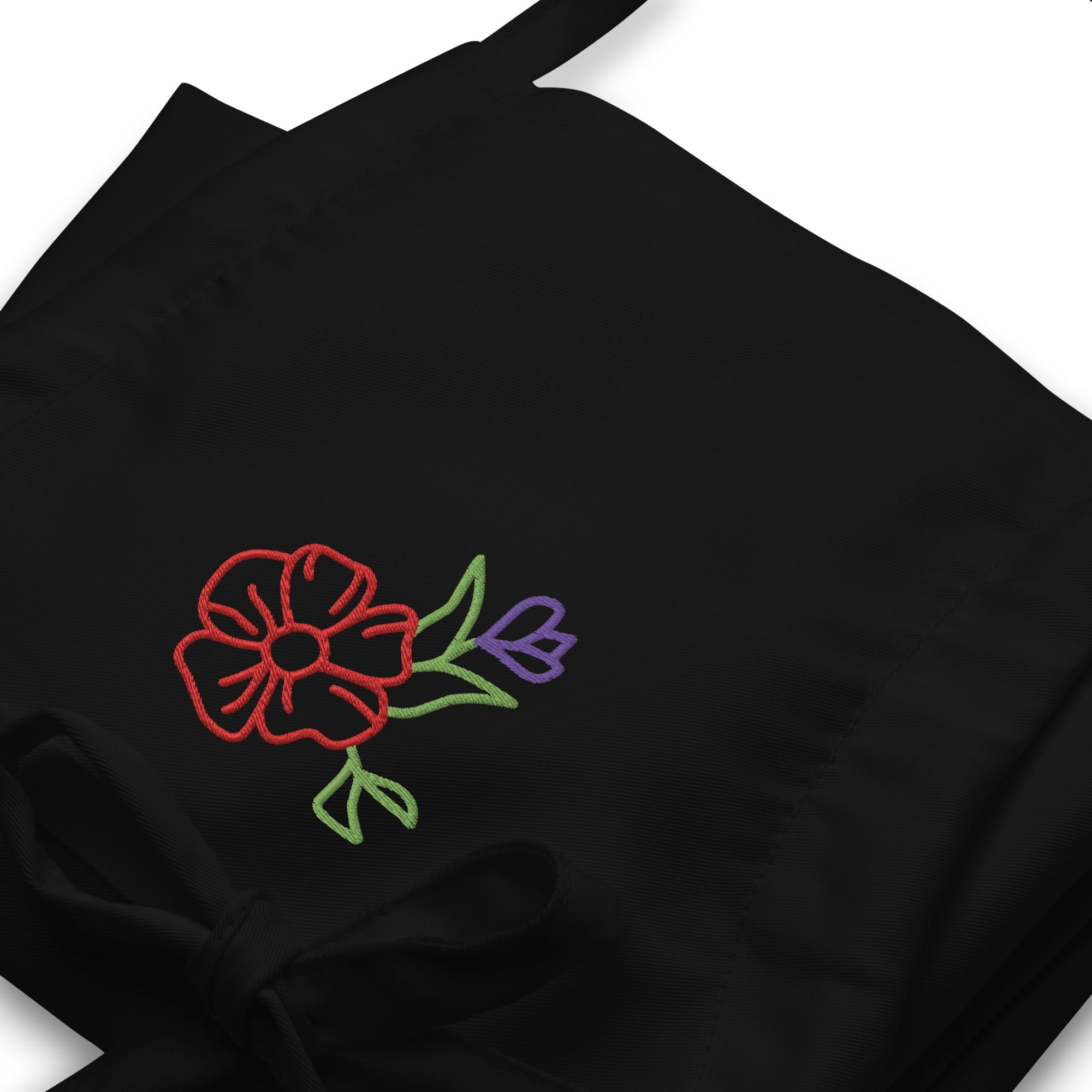 Black Embroidered Floral Apron: Stylish cooking apron with a vibrant flower design for chefs, bakers, and home cooks.