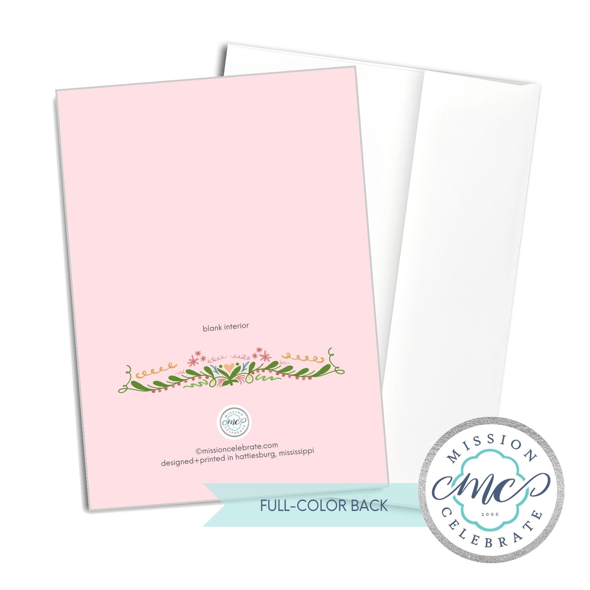Mission Celebrate greeting card back view: floral design, pink background, and logo.