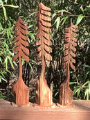 Angled view of three handcrafted miniature cedar trees – rustic decor made in Mississippi by Grayson Unlimited