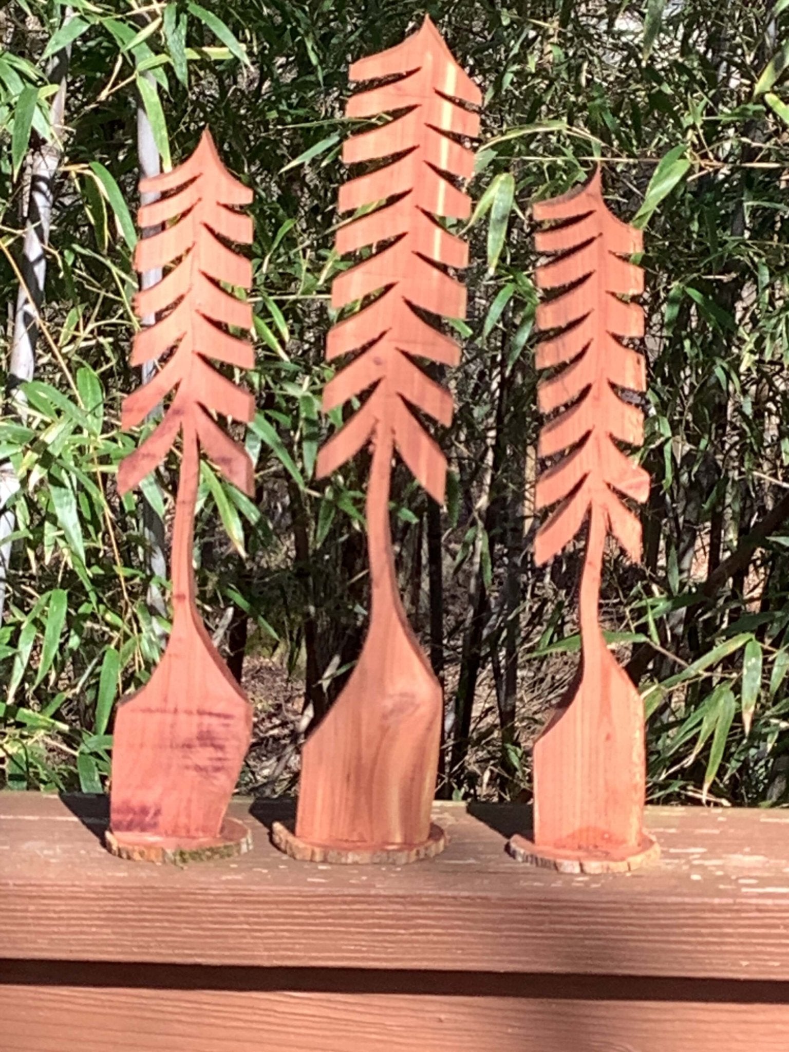 Front view of tall handcrafted cedar tree made from storm-damaged wood – Grayson Unlimited