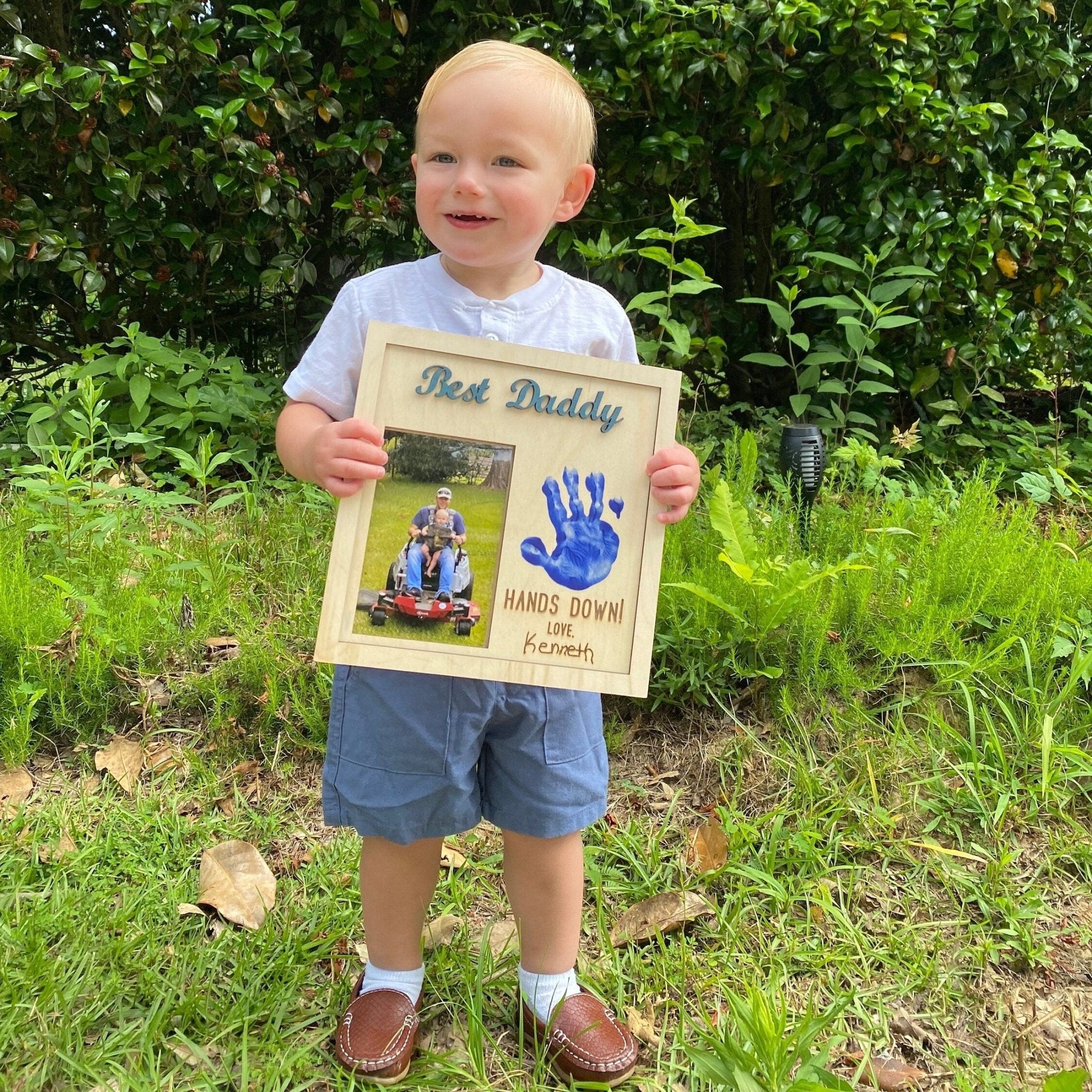 Father's Day DIY Gift: Child Holding "Best Daddy Hands Down" Handprint Photo Frame by Main Street Collective