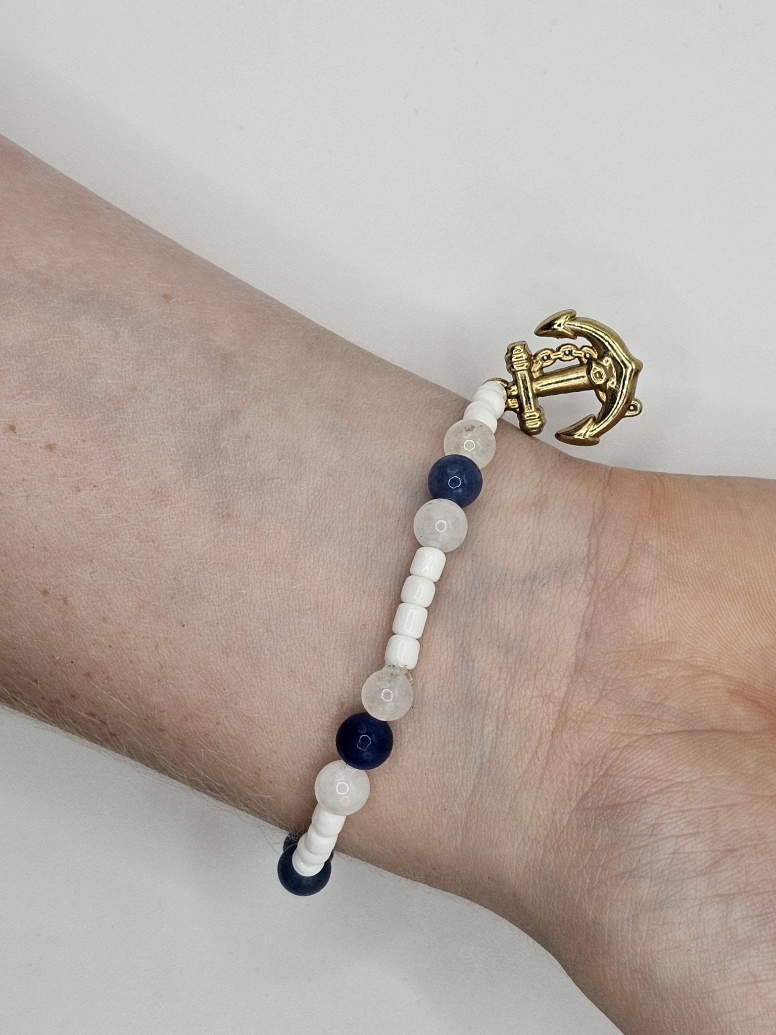 Nautical Anchor Bracelet: Navy White Beaded Bracelet with Gold Anchor Charm by Nora at Main Street Collective