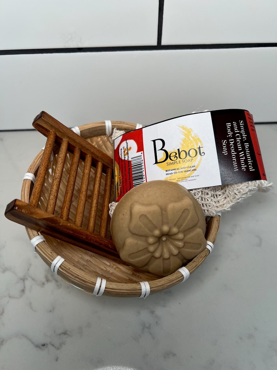 Bebot Simple Soap in a bath basket. Natural handmade bath soap, botanical skincare product.