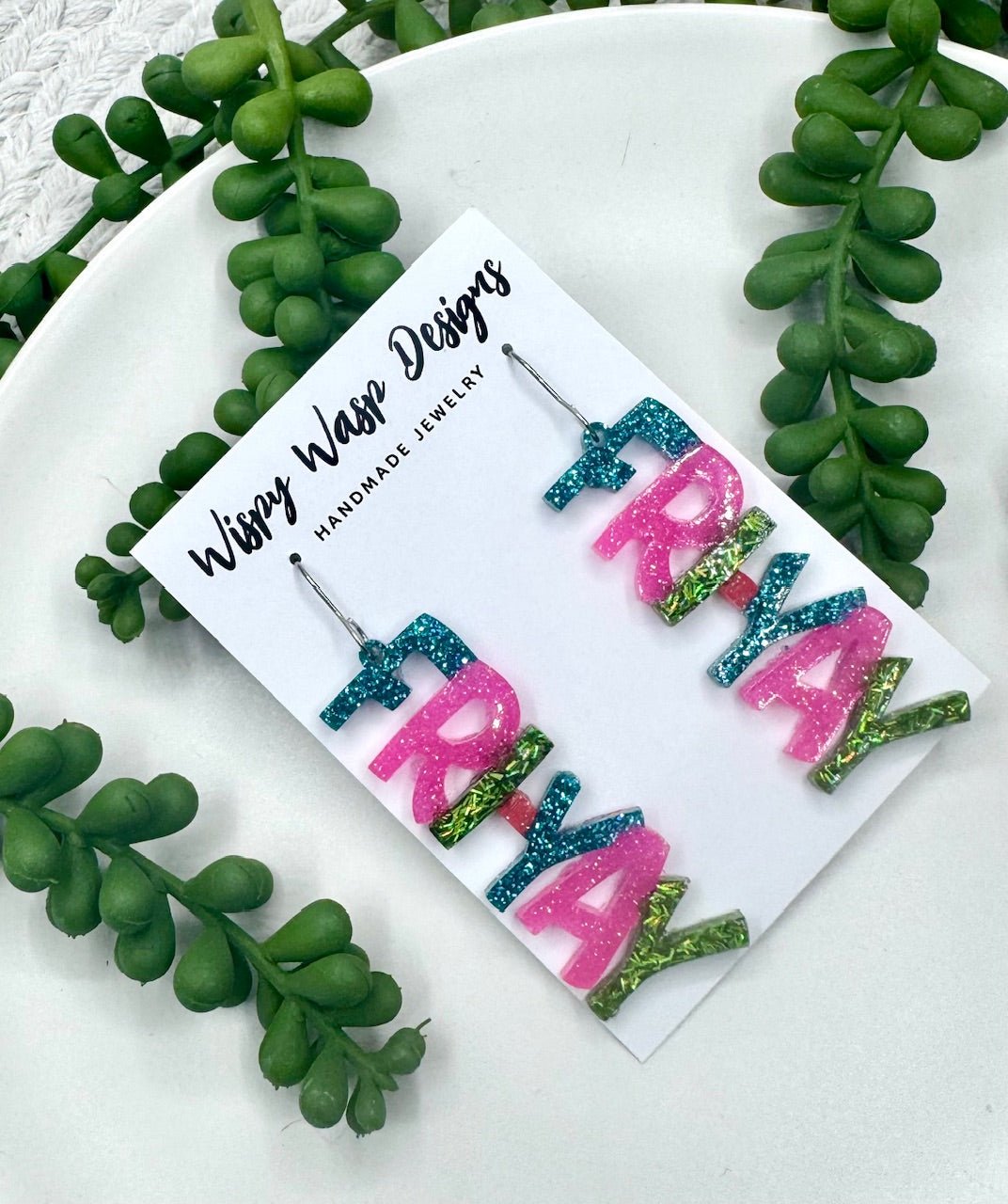 FRI-YAY Earrings by Wispy Wasp Designs: Handmade glitter earrings in pink, teal, and green. Available at Main Street Collective.