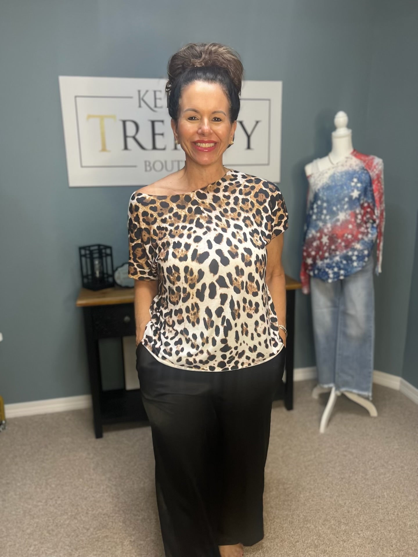 Woman in Leopard Print One-Shoulder Top | Fashionable Boutique Style