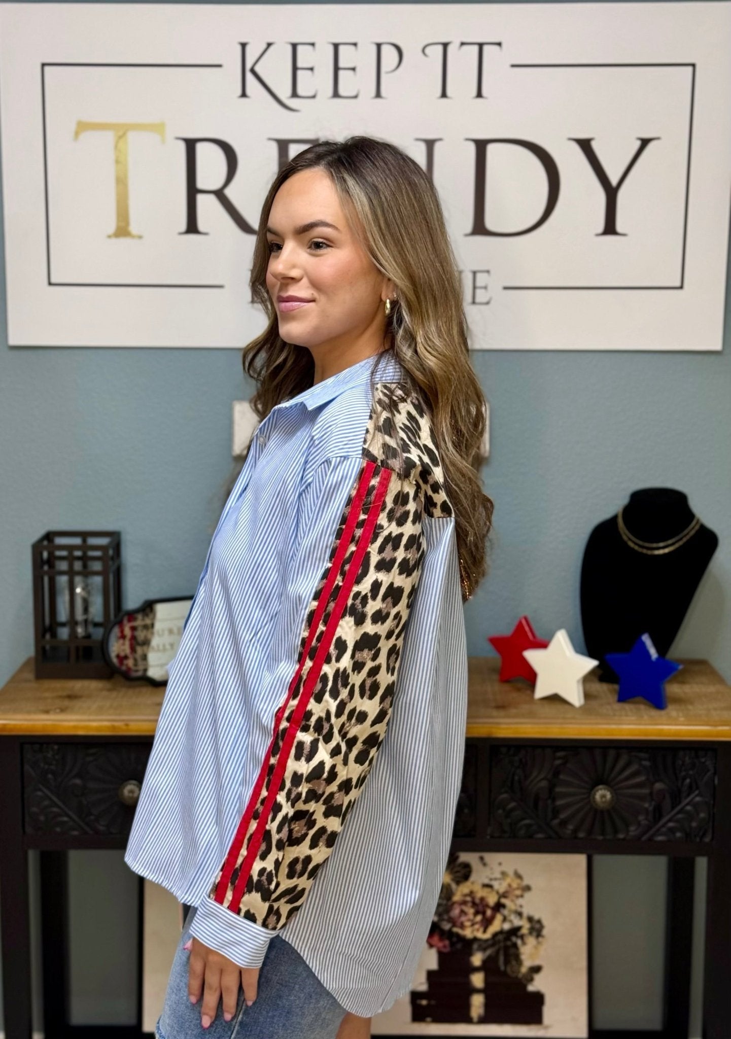 Lasting Impression Striped Top: Blue & White Stripes, Leopard Print Sleeves, Red Stripe Detail. Keep It Trendy Boutique Shirt.