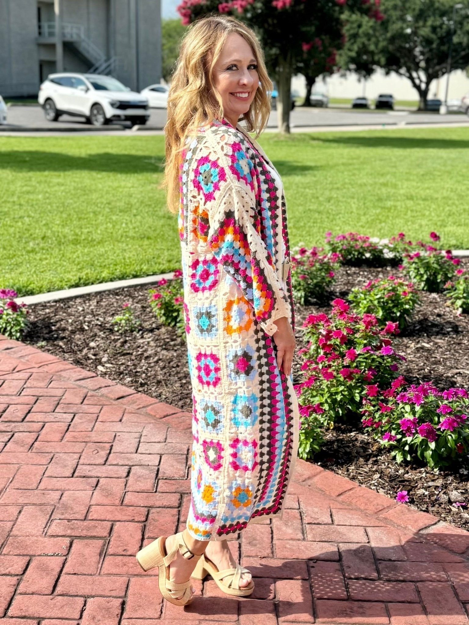 Woman in Bohemian Crochet Cardigan - Multicolored Open Front Style by Main Street Collective