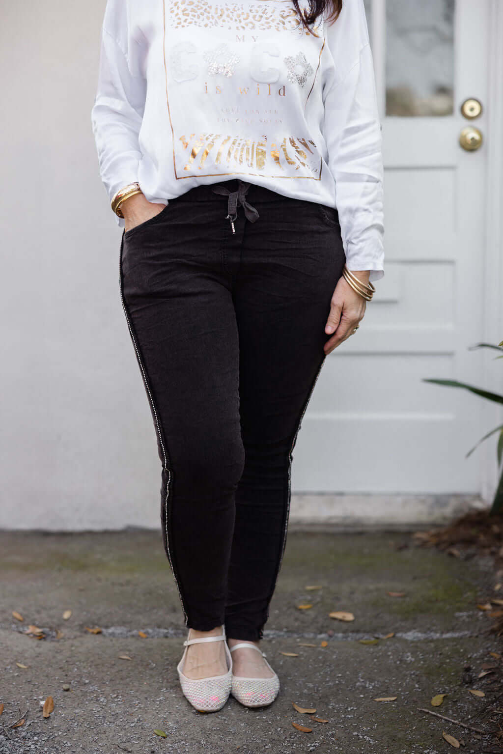 Rhinestone Magic Pants by Keep It Trendy – boutique sparkle pants modeled front view.