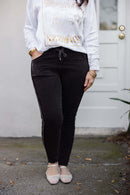 Rhinestone Magic Pants by Keep It Trendy – boutique sparkle pants modeled front view.