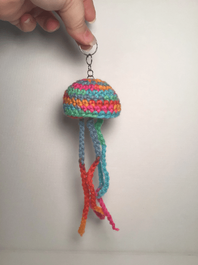 Handmade crochet jellyfish keychain from Main Street Collective, Hattiesburg Pocket Museum featured.