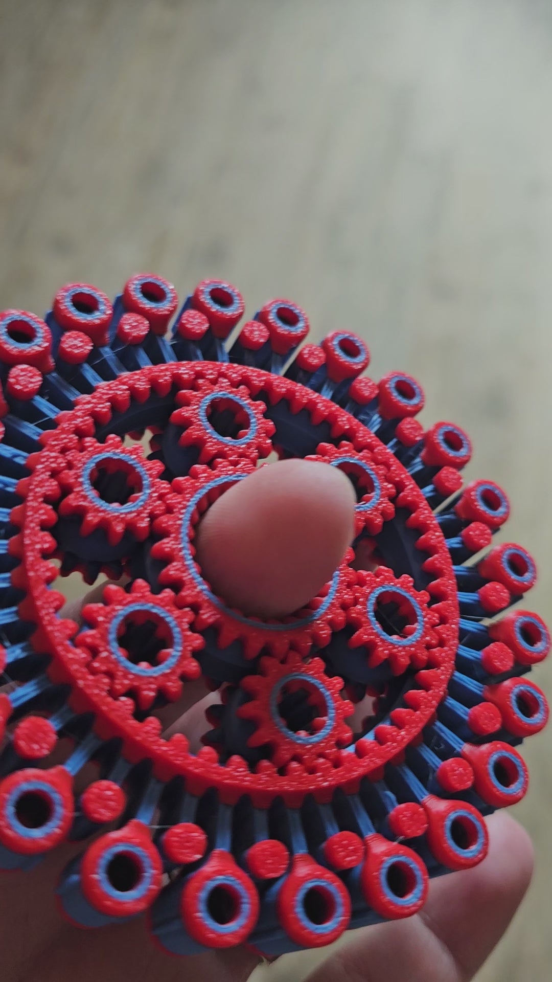 Turbo gear Figdet Spinner toy in red and blue
