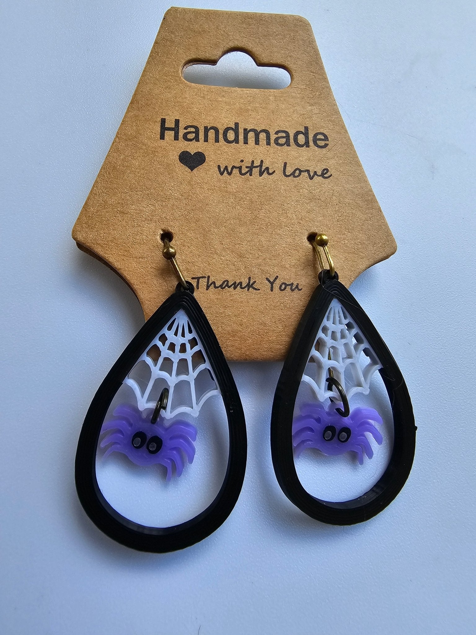 Purple spider web earrings. Halloween goth style. Handmade earrings by Nora at The Tween Space. Lightweight, hypoallergenic.