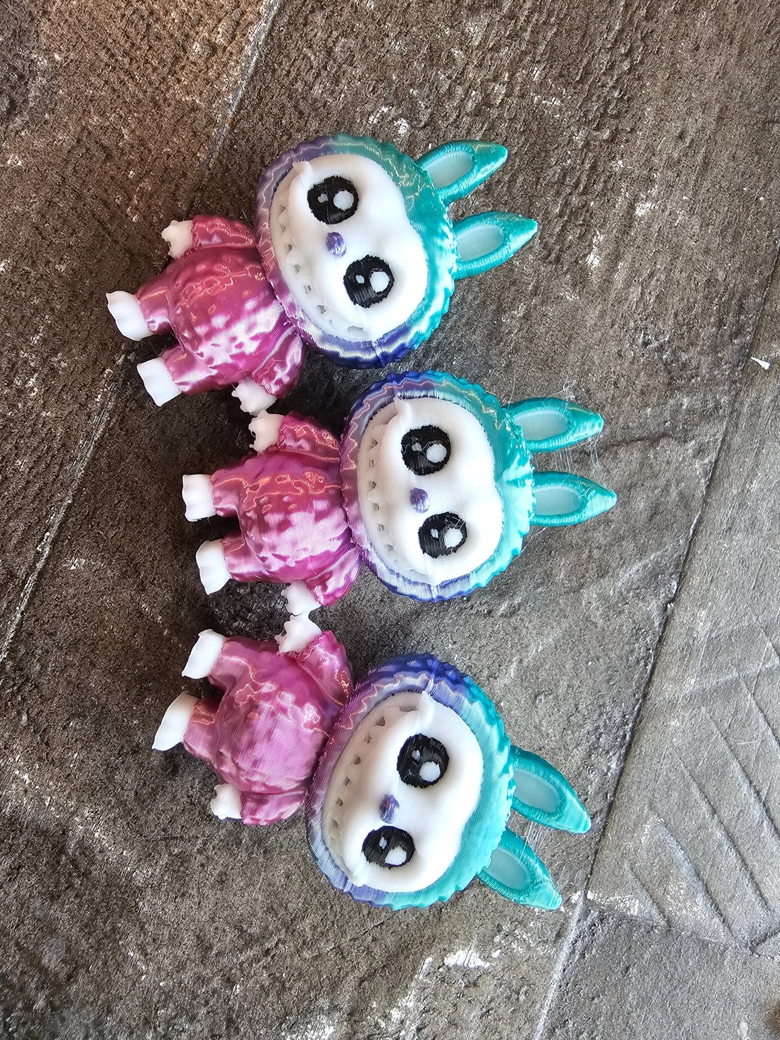 3D printed mini bunny figurines by The Tween Space, teal ears, pink body, handmade art, collectible cute monsters, Main Street Collective