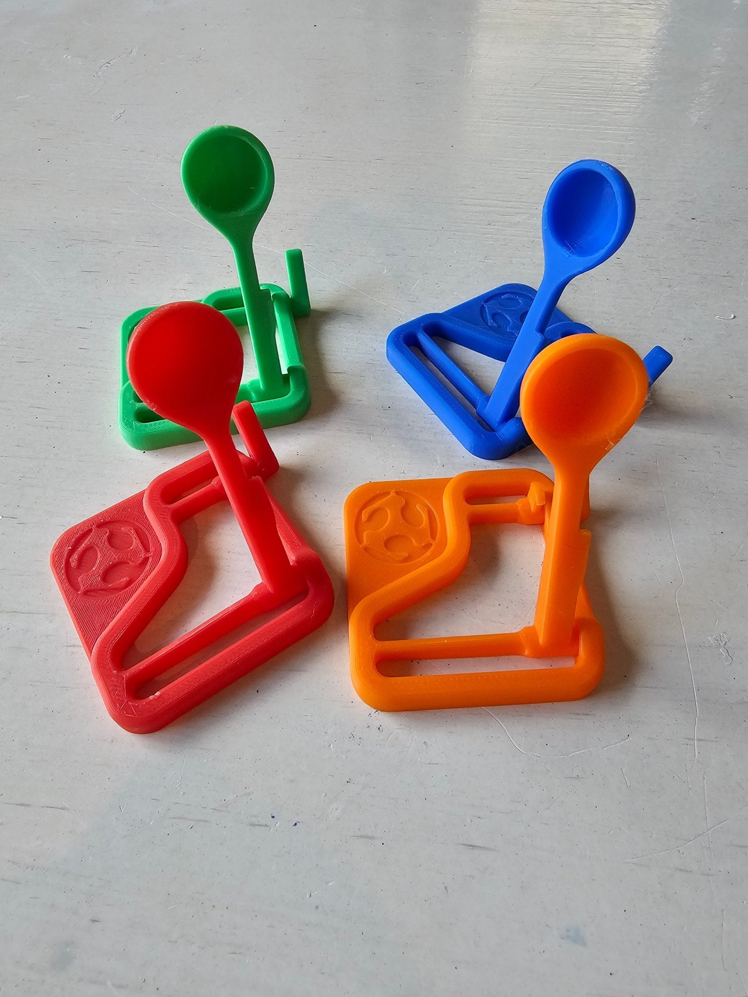 Mini Catapult Launcher Set: STEM Toy, 3D Printed, Handmade, Fun for Kids and Adults. Green, Blue, Red and Orange colored catapults