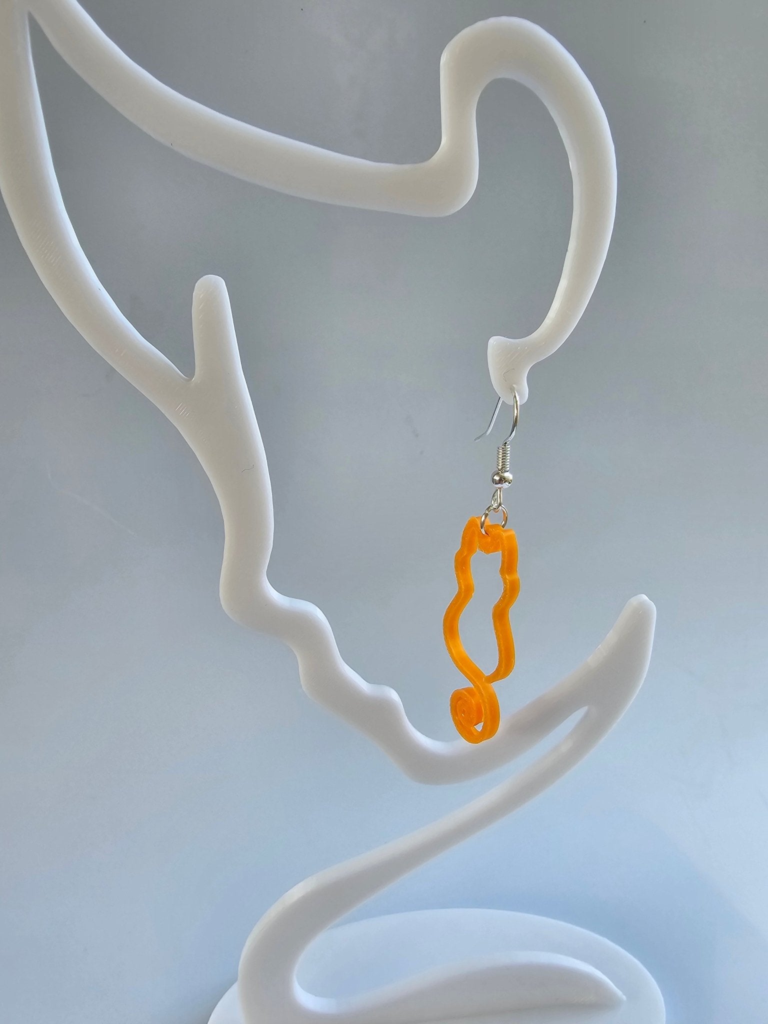 Curly Tail Cat Earrings: Orange 3D Printed Cat Earring handmade by Nora at The Tween Space