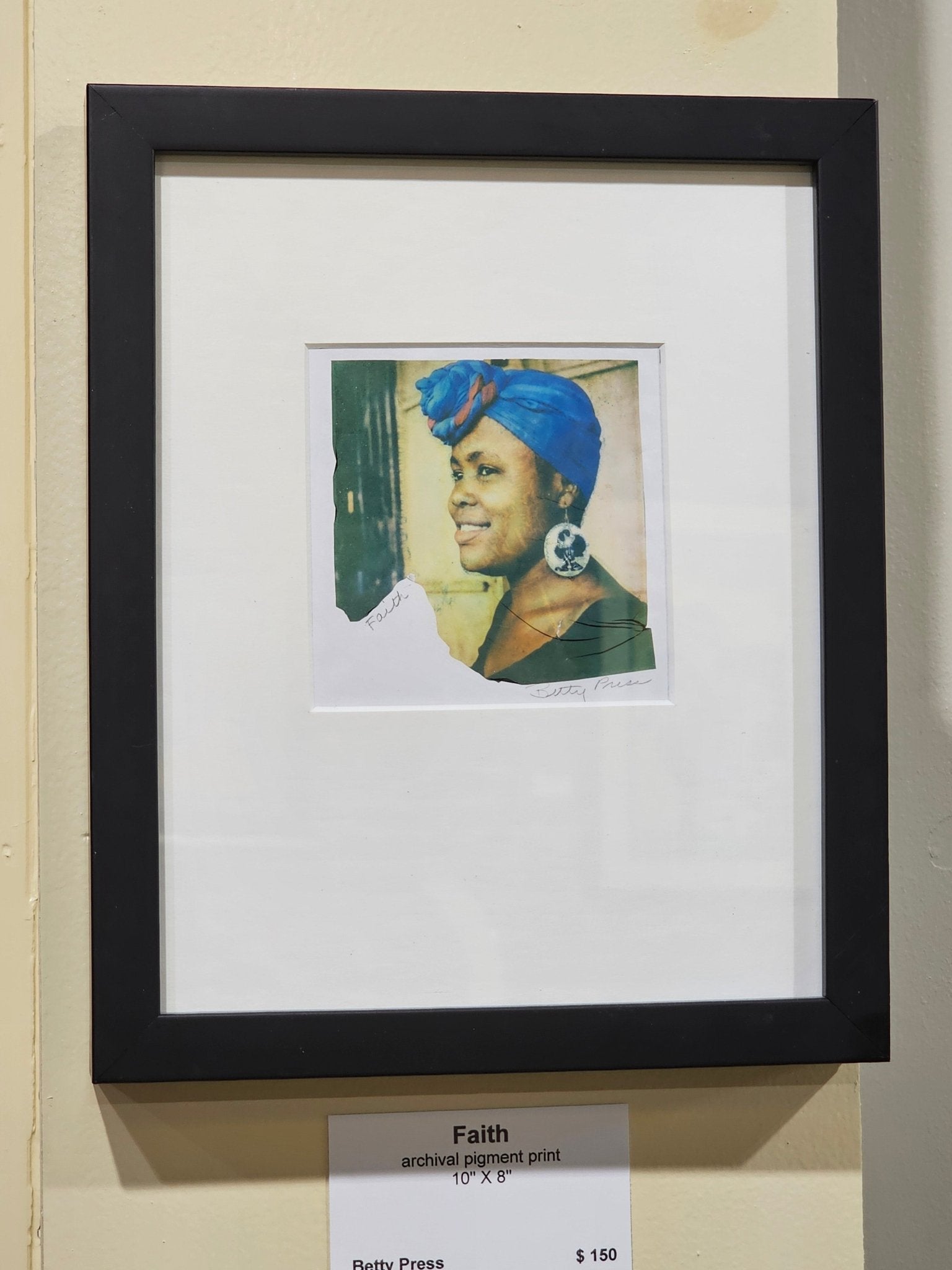Faith artwork by Betty Press: Woman with blue headwrap, archival pigment print, black frame, 10x8. Unique emulsion lift photo.