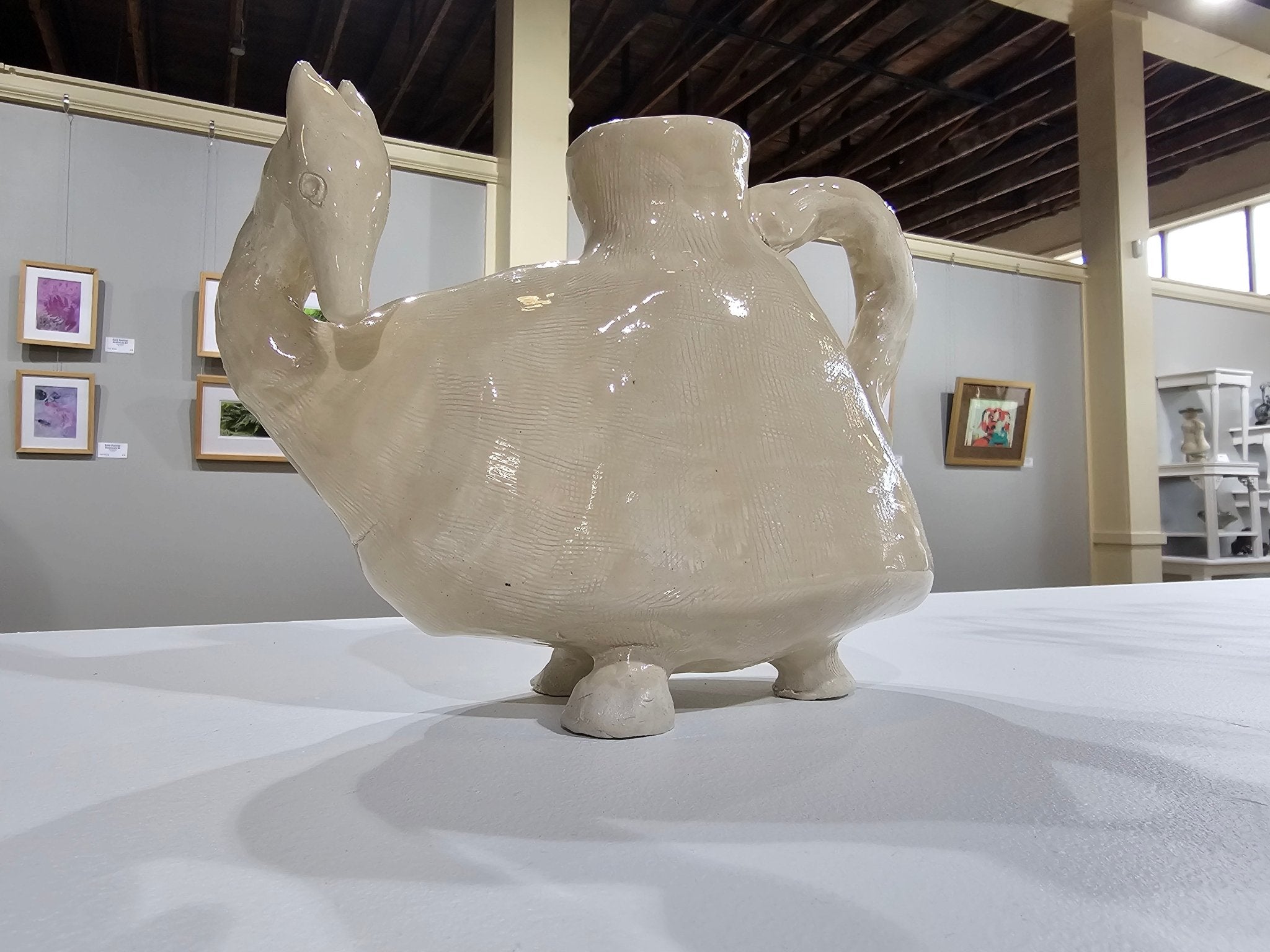 Ceramic vessel with animal head sculpture by Stephanie Scull-DeArmey. Unique art piece.