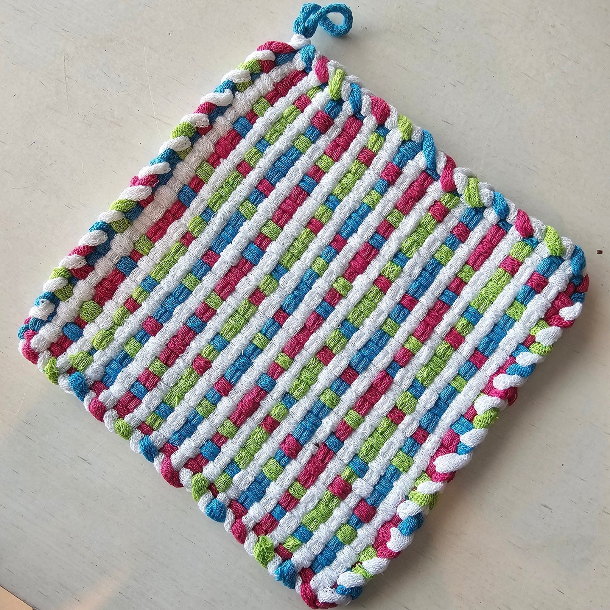 Colorful Handmade Woven Potholder - Vibrant kitchen accessory for heat protection and style.