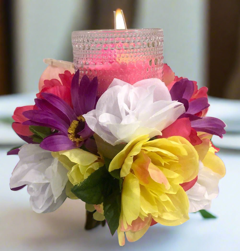 Floral candle centerpiece. Decorative candle holder with flowers for home decor.