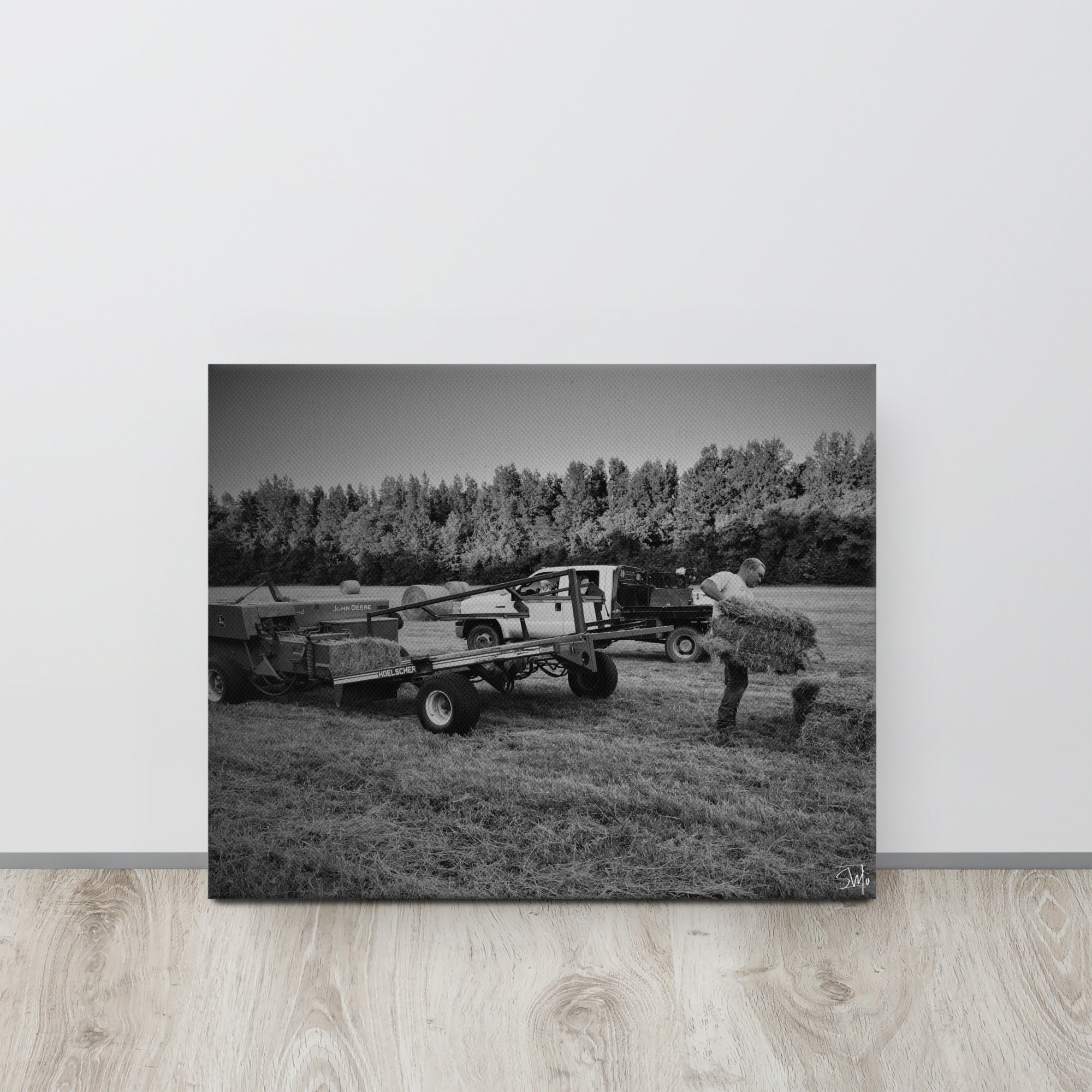 Grayscale Farm Scene Canvas Print: Farmer Loading Hay Bales on Trailer - Nostalgic Wall Art