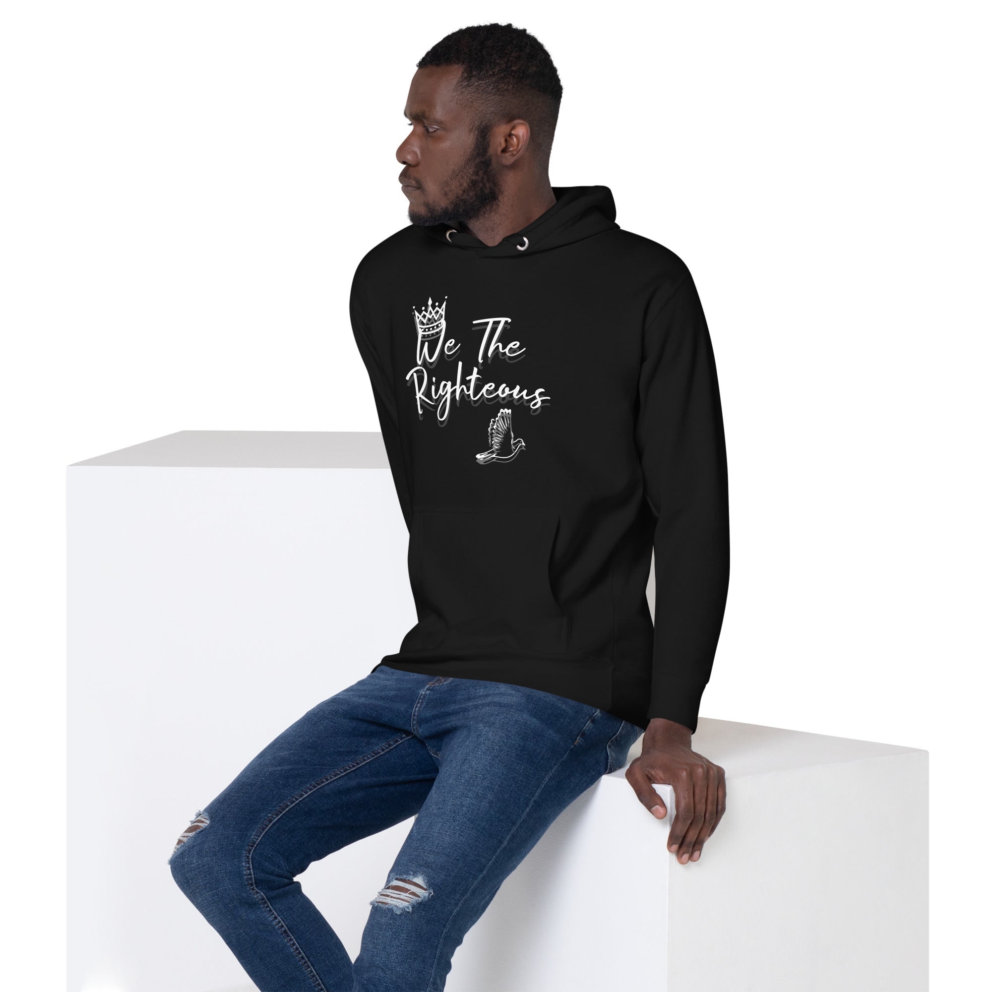 Man in black "We The Righteous" hoodie, unisex faith-based apparel from Main Street Collective. Crown and dove design.